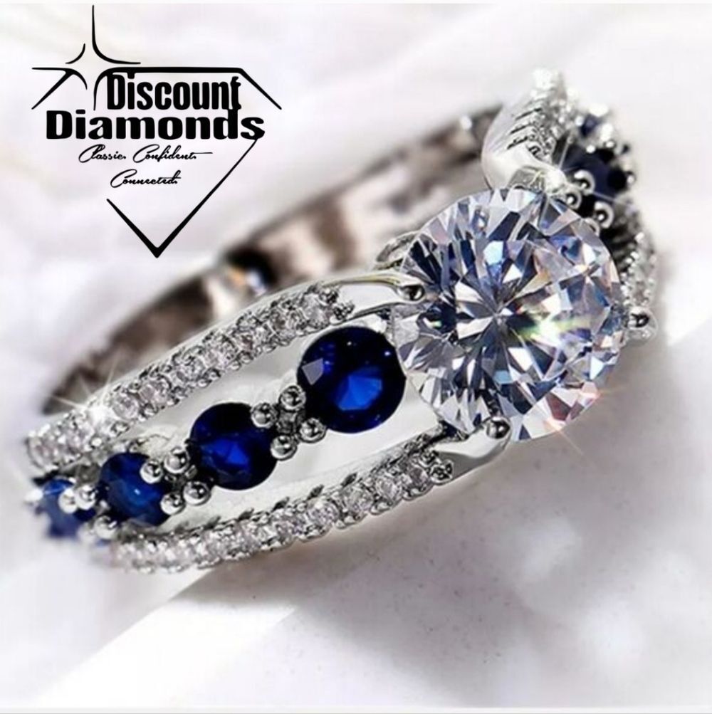 Blue Sapphire & Clear White Diamond Center Stone & Baguette Diamonds